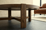 A Mondavio leg in Smokey Chestnut at floor level: the tapered wedge peg and the low X stretcher