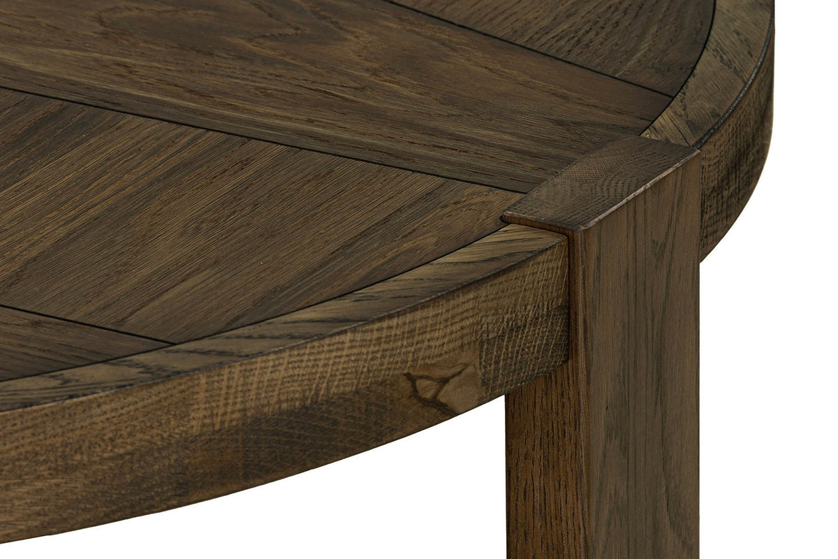 Close-up of the Mondavio rim in Smokey Chestnut: a flat plank leg passing up through the rim