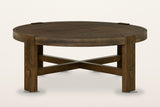 Mondavio round coffee table in Smokey Chestnut on a warm white studio backdrop: a patchwork top