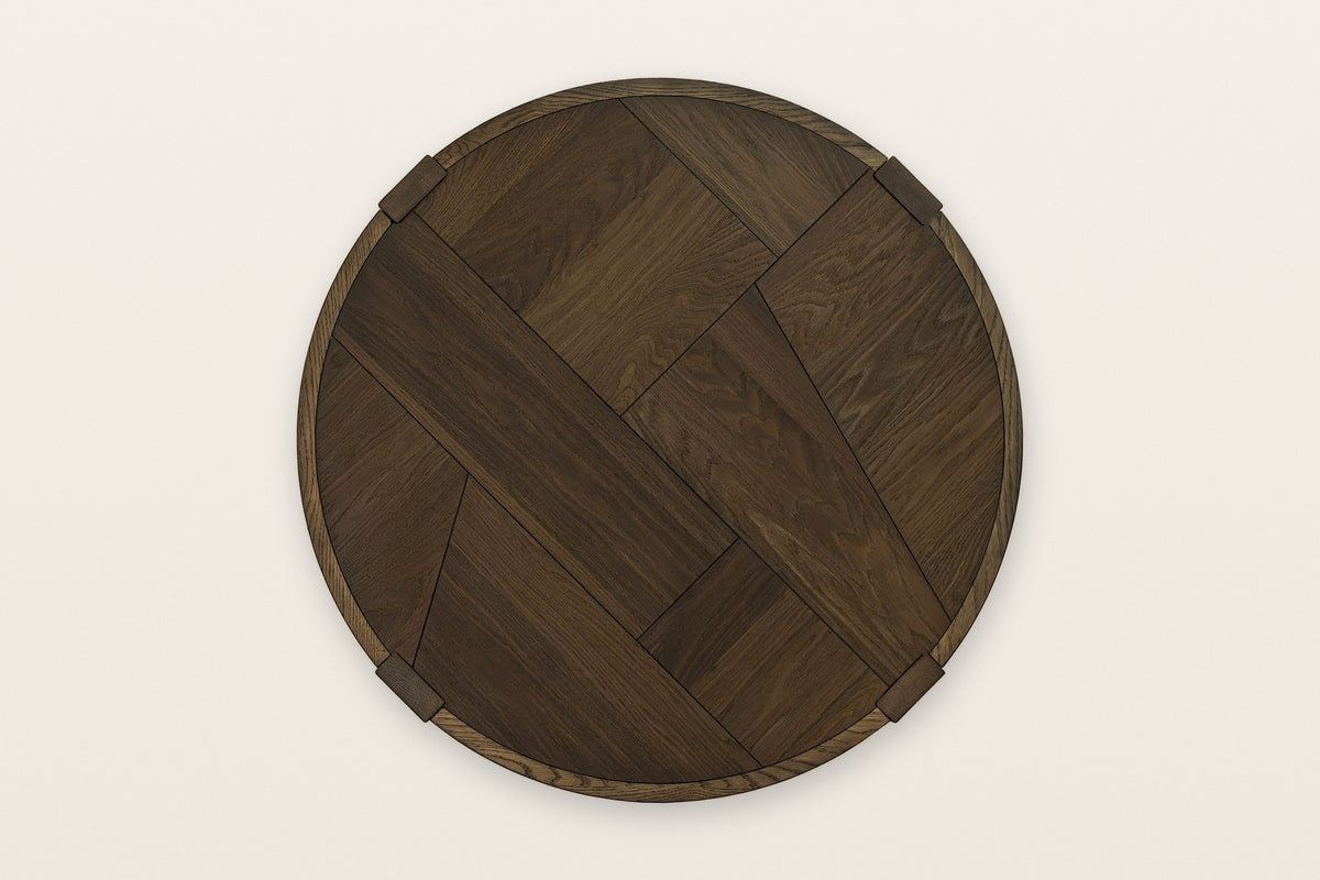 The Mondavio top seen from above in Smokey Chestnut: a patchwork of large oak pieces inside a thin rim, with four leg ends
