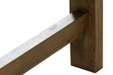 Close-up of a Mondavio leg in Smokey Chestnut: a flat oak leg to the floor, the low end bar joining it