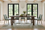 Mondavio dining table in Smokey Chestnut in a Prince Edward County farmhouse with limewashed walls, oak beams
