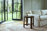 Mondavio side table in Smoked Acacia beside a skirted linen sofa in an Oak Bay house, with sage panelling