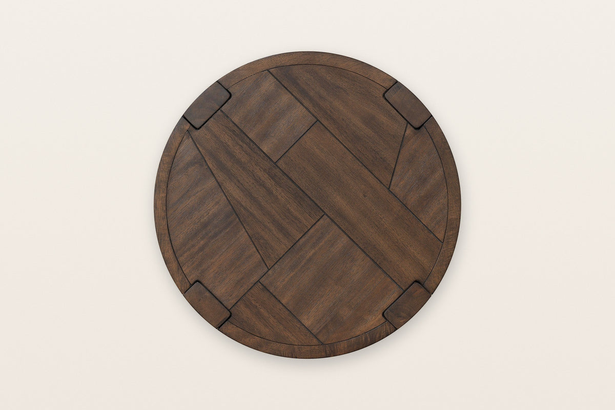 The Mondavio top seen from above in Smoked Acacia: an acacia veneer mosaic inside a round rim