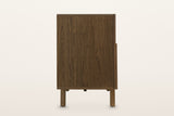 Mondavio sideboard in Smokey Chestnut, end view on a warm white studio backdrop: a plain oak end panel above a front post