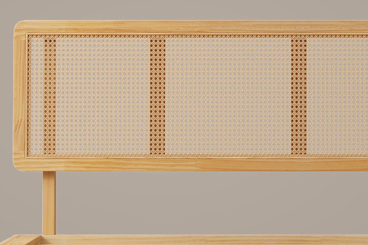 Close-up of the Montalcino headboard: rounded wood corner, open-weave cane panels and one round post