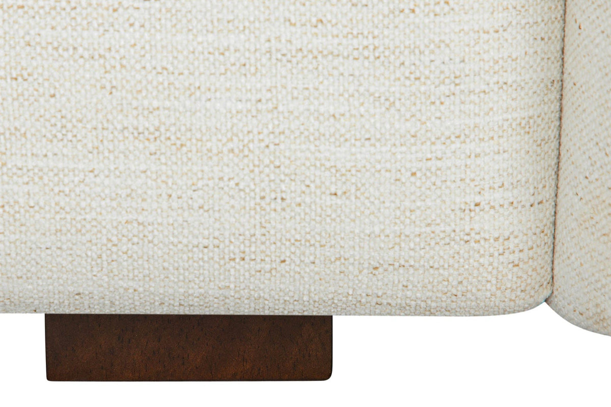 Close-up of a Montecassiano foot: a dark brown block under the cream fabric base