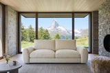 Montecassiano sofa in Cream facing the camera in a Zermatt chalet with silvered larch walls