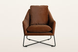 Montelupone accent chair in Rust, straight front view on a warm white studio backdrop: the shell flares out toward the top