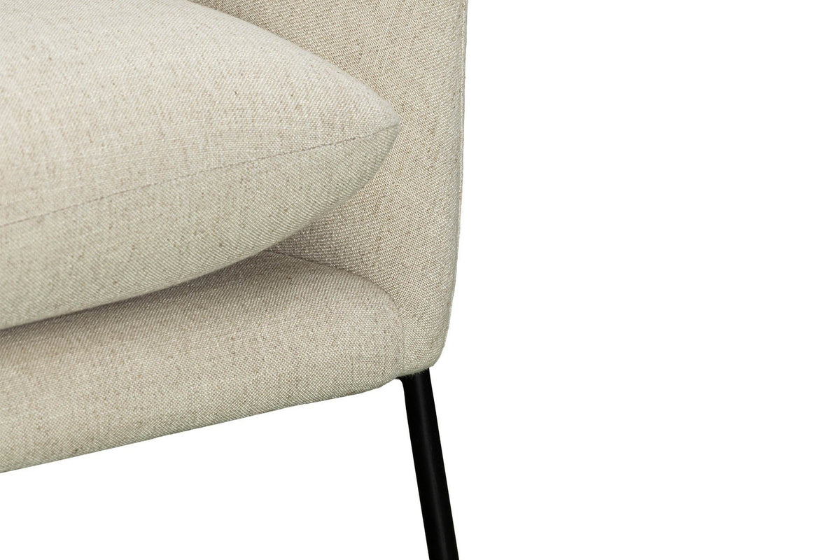Close-up of the Montelupone in Taupe: the back cushion, the seam along the arm and the front rod leg
