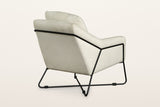 Montelupone accent chair in Taupe from the back at three-quarter on a warm white studio backdrop: the rod crosses the outside