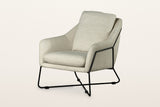 Montelupone accent chair in Taupe, three-quarter view on a warm white studio backdrop: an upholstered shell with low sloping