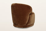 Monterubbiano accent chair in Bronze velvet from the back at three-quarter on a warm white studio backdrop