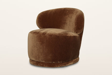 Monterubbiano accent chair in Bronze velvet, three-quarter view on a warm white studio backdrop