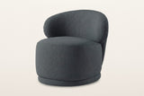 Monterubbiano accent chair in Charcoal twill, three-quarter view on a warm white studio backdrop