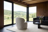 Monterubbiano accent chair in Ivory twill seen from behind in a Margaree valley house in Cape Breton