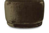Close-up of the Monterubbiano seat in Khaki Green velvet: the rounded drum front and the low plinth below it