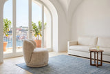 Monterubbiano accent chair in Natural velvet in side view in a Procida island house on the Bay of Naples