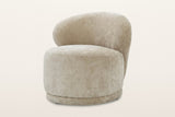 Monterubbiano accent chair in Natural velvet, three-quarter view on a warm white studio backdrop