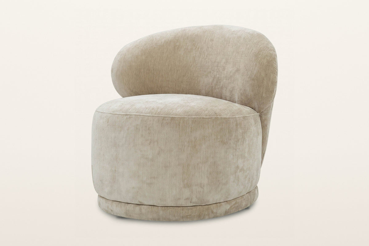 Monterubbiano accent chair in Natural velvet, three-quarter view on a warm white studio backdrop