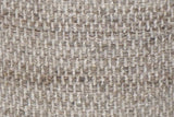 Close-up of the Morgex basket-weave wool: small raised blocks of ivory and greige-taupe yarn