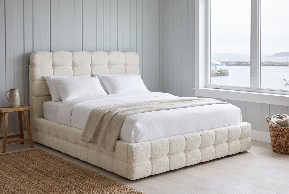 Nemi bed in a pale plank-walled Halifax bedroom with a window onto the harbour