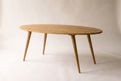 Nolan solid acacia oval dining table in Honey