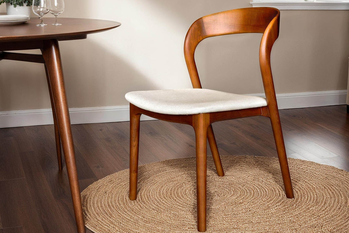 Norwood walnut ash dining chair with cream seat on a jute rug beside a round table