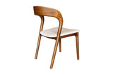 Norwood walnut dining chair, rear three-quarter view of the sculpted back