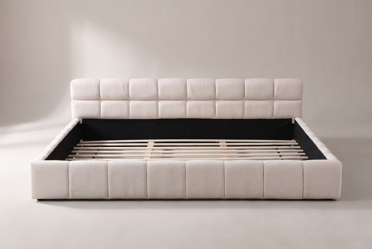 Noto bed in beige chenille, straight front view: a low headboard of two rows of eight blocks and a foot rail of eight blocks