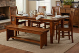 Novella dining table set for dinner with the Novella bench in a farmhouse dining room