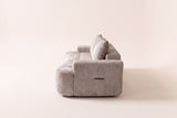 The Nuvola sofa in Camel seen from one end, showing its depth and low arm