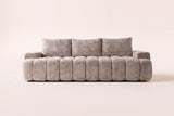 The Nuvola sofa in Camel seen straight on, showing the vertical channels across the seat