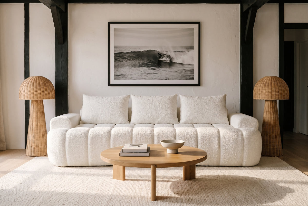 The Nuvola sofa in White in a Basque-style villa in Hossegor with beams, a cream rug and an oak coffee table