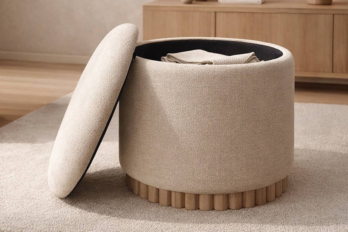 Nyla oat storage ottoman with its lid off beside a wood sideboard