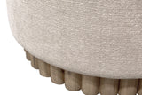 Close-up of Nyla oat fabric over the reeded natural wood base