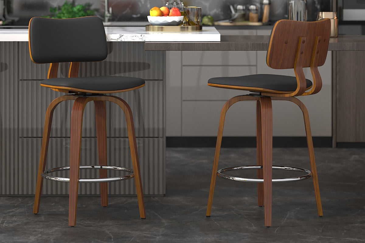 Oakes black faux leather and walnut swivel counter stools at a grey kitchen island