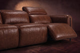 The Octavia 3 seat in Burnished Chestnut distressed full leather on a dark herringbone floor, close on the right recliner, open with its headrest raised. Shown in Burnished Chestnut, 3 seat.
