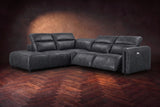 Octavia sectional in Aged Slate on a walnut herringbone floor, three-quarter view, both recliners open and the headrests raised, Left bumper.