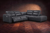 Octavia sectional in Aged Slate on a walnut herringbone floor, three-quarter view, both recliners open and the headrests raised, Right bumper.