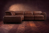 Octavia sectional in Burnished Chestnut on a walnut herringbone floor, seen from the front, footrests closed, Left bumper.