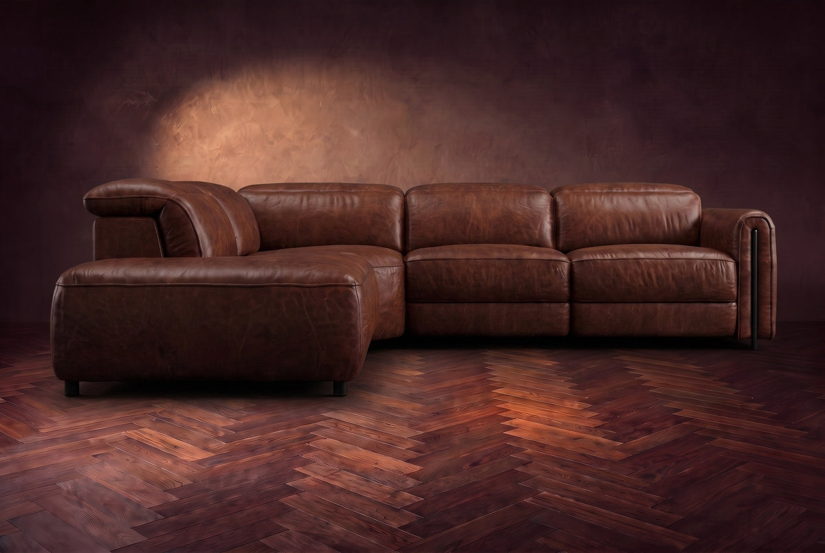 Octavia sectional in Burnished Chestnut on a walnut herringbone floor, seen from the front, footrests closed, Left bumper.