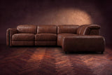 Octavia sectional in Burnished Chestnut on a walnut herringbone floor, seen from the front, footrests closed, Right bumper.