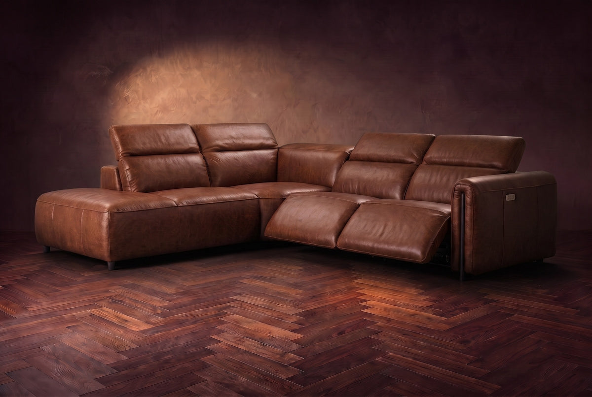 Octavia sectional in Burnished Chestnut on a walnut herringbone floor, three-quarter view, both recliners open and the headrests raised, Left bumper.