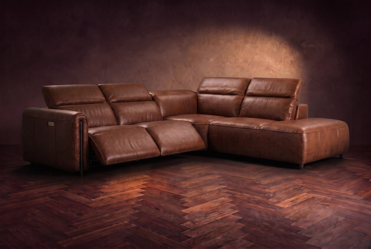 Octavia sectional in Burnished Chestnut on a walnut herringbone floor, three-quarter view, both recliners open and the headrests raised, Right bumper.