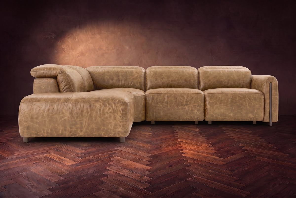 Octavia sectional in Washed Sand on a walnut herringbone floor, seen from the front, footrests closed, Left bumper.