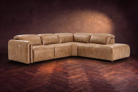 Octavia sectional in Washed Sand on a walnut herringbone floor, three-quarter view, headrests down and footrests closed, Right bumper.