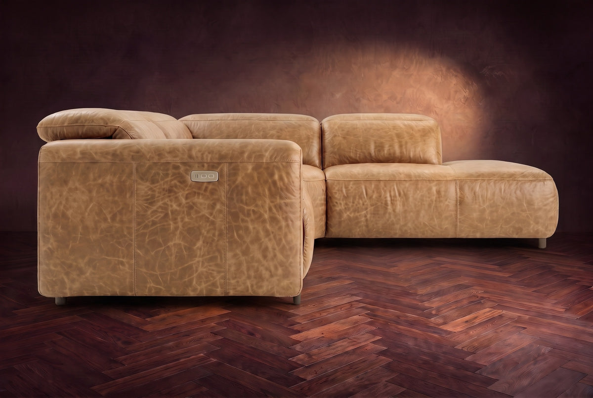 Octavia sectional in Washed Sand on a walnut herringbone floor, seen from the arm end, footrests closed, Right bumper.