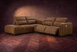 Octavia sectional in Weathered Saddle on a walnut herringbone floor, three-quarter view, both recliners open and the headrests raised, Left bumper.