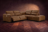 Octavia sectional in Weathered Saddle on a walnut herringbone floor, three-quarter view, both recliners open and the headrests raised, Right bumper.
